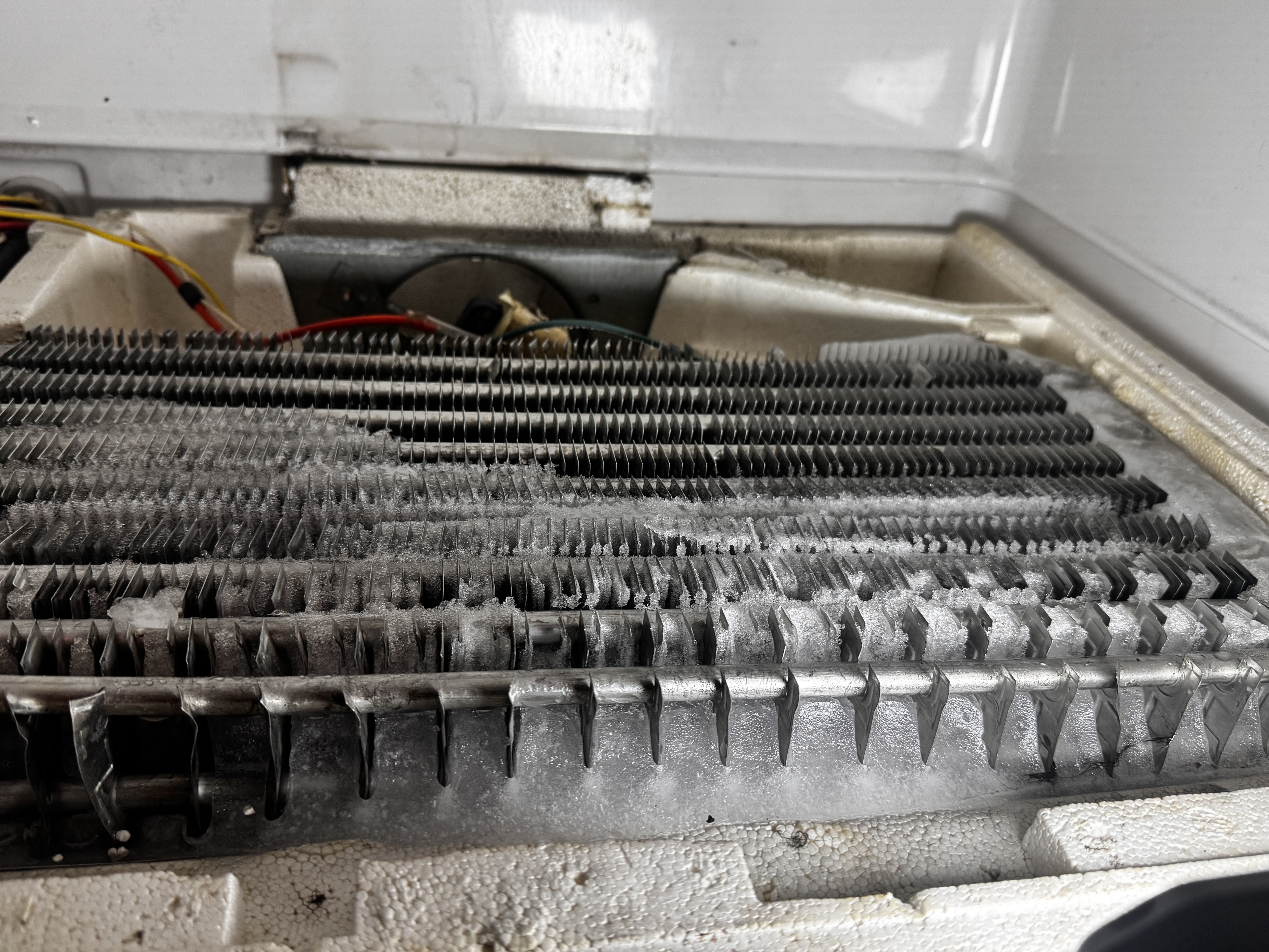 Heavily frosted evaporator coils — failed defrost system